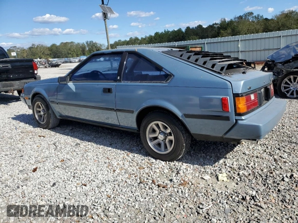 1983 Toyota Celica z VIN JT2RA64L7D6174381, wystawiony jako Copart lot #75986554 z przebiegiem 312 583 mil mil oraz Szkoda całkowita • Salvage title. Historia ofert i sprzedaży dostępna na DreamBid. Obrazek 2.