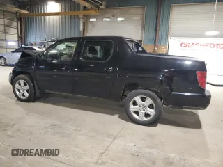 2010 Honda Ridgeline RTL with VIN 5FPYK1F5XAB011944, listed as a Copart auction lot 52434175 with 137,585 mi miles and Salvage title. Bid and sale history available at DreamBid. Image 2.