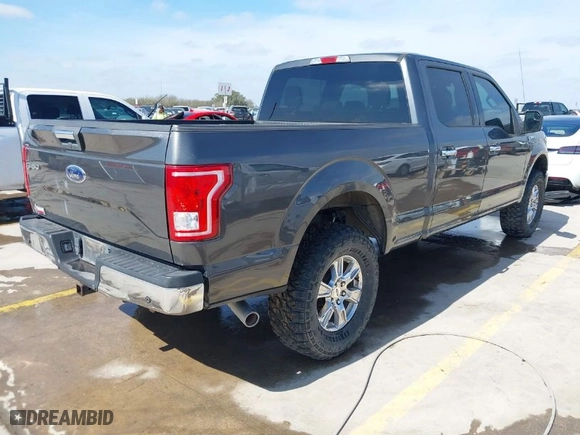 2015 Ford F-150 XLT w/HD Payload Pkg with VIN 1FTFW1EF7FKD04869, listed as a IAAI auction lot 41664736 with 165,784 mi miles. Bid and sale history available at carsss.com. Image 4.
