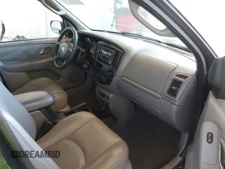 2002 Mazda Tribute LX with VIN 4F2CU08172KM58561, listed as a IAAI auction lot 41435407 with 141,908 mi miles and . Bid and sale history available at carsss.com. Image 5.