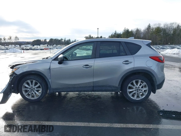 2014 Mazda CX-5 Grand Touring with VIN JM3KE2DY8E0304911, listed as a IAAI auction lot 41672197 with 77,523 mi miles. Bid and sale history available at carsss.com. Image 14.