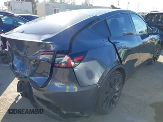 2022 Tesla Model Y Performance with VIN 7SAYGDEF7NF562895, listed as a IAAI auction lot 41692864 with 29,904 mi miles and . Bid and sale history available at DreamBid. Image 4.