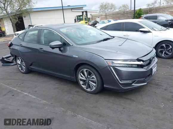2018 Honda Clarity Plug-In Hybrid with VIN JHMZC5F14JC017006, listed as a IAAI auction lot 42064754 with 36,976 mi miles. Bid and sale history available at carsss.com. Image 1.