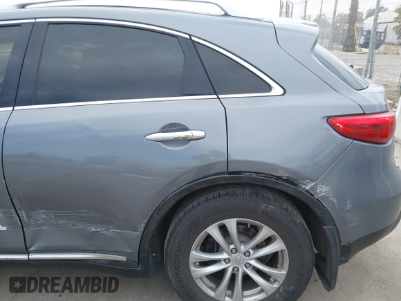 2014 Infiniti QX70 with VIN JN8CS1MU8EM450428, listed as a IAAI auction lot 42233727 with 88,342 mi miles and . Bid and sale history available at DreamBid. Image 6.