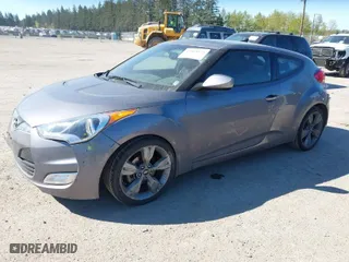 2013 Hyundai Veloster w/Black Int with VIN KMHTC6AD8DU103122, listed as a IAAI auction lot 42068175 with 123,512 mi miles. Bid and sale history available at carsss.com. Image 2.