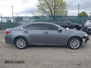 2013 Lexus ES 4dr Sdn with VIN JTHBK1GG0D2074698, listed as a IAAI auction lot 42049070 with 117,036 mi miles. Bid and sale history available at carsss.com. Image 12.