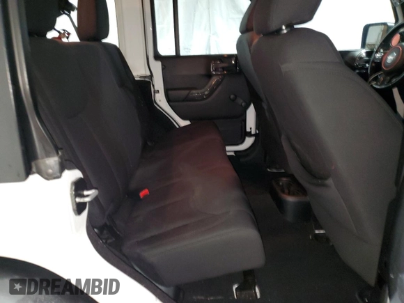 2014 Jeep Wrangler Unlimited Sport with VIN 1C4BJWDG4EL125251, listed as a Copart auction lot 51092675 with 76,867 mi miles and Clean Title. Bid and sale history available at carsss.com. Image 11.