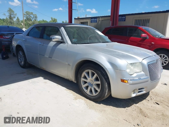 2005 Chrysler 300 with VIN 2C3AA63HX5H125777, listed as a IAAI auction lot 41843281 with 115,034 mi miles. Bid and sale history available at carsss.com. Image 1.