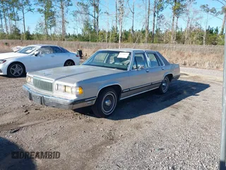1989 Mercury Grand Marquis z VIN 2MEBM75F1KX629370, wystawiony jako IAAI lot #41718097 z przebiegiem 98 862 mil mil oraz . Historia ofert i sprzedaży dostępna na DreamBid. Obrazek 2.