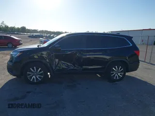 2021 Honda Pilot EX-L with VIN 5FNYF5H55MB044677, listed as a IAAI auction lot 42038704 with 38,684 mi miles and . Bid and sale history available at carsss.com. Image 15.