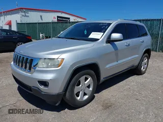 2011 Jeep Grand Cherokee Laredo with VIN 1J4RR4GG2BC737400, listed as a IAAI auction lot 42259167 with 153,211 mi miles and . Bid and sale history available at DreamBid. Image 2.