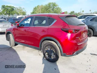 2020 Mazda CX-5 Touring with VIN JM3KFACMXL1819518, listed as a IAAI auction lot 41911679 with 50,357 mi miles and . Bid and sale history available at carsss.com. Image 3.