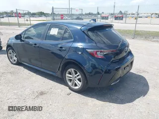 2019 Toyota Corolla Hatchback SE with VIN JTNK4RBE3K3061589, listed as a IAAI auction lot 42123273 with 90,491 mi miles. Bid and sale history available at carsss.com. Image 3.