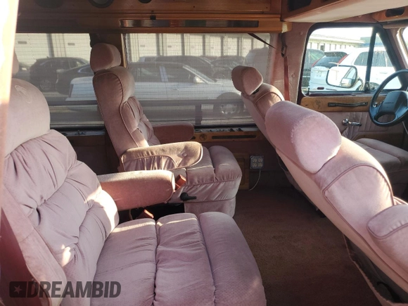 1993 Chevrolet Chevy Van z VIN 1GBEG25K8PF357638, wystawiony jako Copart lot #69878944 z przebiegiem 170 004 mil mil oraz Szkoda całkowita • Salvage title. Historia ofert i sprzedaży dostępna na DreamBid. Obrazek 11.