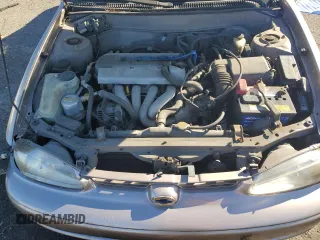 1998 Chevrolet Prizm z VIN 1Y1SK5289WZ434033, wystawiony jako Copart lot #54037694 z przebiegiem 76 601 mil mil oraz Szkody całkowita. Historia ofert i sprzedaży dostępna na DreamBid. Obrazek 22.