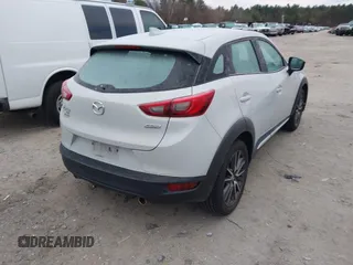 2016 Mazda CX-3 Grand Touring with VIN JM1DKFD7XG0132084, listed as a IAAI auction lot 41004954 with 70,476 mi miles. Bid and sale history available at carsss.com. Image 4.