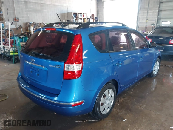 2010 Hyundai Elantra Touring SE with VIN KMHDC8AE8AU077884, listed as a IAAI auction lot 41833566 with 192,421 mi miles. Bid and sale history available at carsss.com. Image 4.