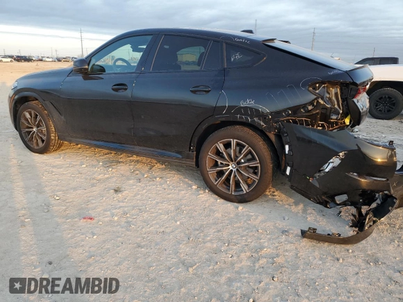 2025 BMW X6 xDrive40i with VIN 5UX33EX09S9Y26463, listed as a Copart auction lot 84269334 with 1,970 mi miles and Salvage Title. Bid and sale history available at carsss.com. Image 2.