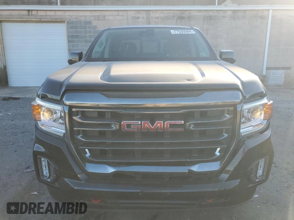 2021 GMC Canyon 4WD AT4 w/Cloth with VIN 1GTG6FEN5M1100096, listed as a Copart auction lot 77535584 with 25,152 mi miles and Salvage Title. Bid and sale history available at carsss.com. Image 5.