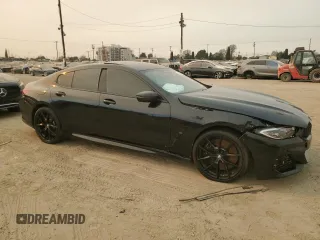 2022 BMW 8 Series M850i with VIN WBAGV8C02NCK08667, listed as a Copart auction lot 88255605 with 22,737 mi miles and Salvage title. Bid and sale history available at DreamBid. Image 4.