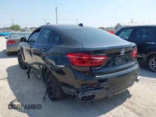 2018 BMW X6 xDrive50i with VIN 5UXKU6C58J0W39038, listed as a IAAI auction lot 40025654 with 106,080 mi miles. Bid and sale history available at carsss.com. Image 3.
