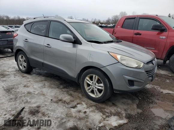 2010 Hyundai Tucson GLS with VIN KM8JU3AC2AU113747, listed as a Copart auction lot 48031375 with 220,982 mi miles and Salvage Title. Bid and sale history available at DreamBid. Image 4.