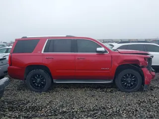 2015 Chevrolet Tahoe LTZ z VIN 1GNSKCKC6FR276531, wystawiony jako IAAI lot #41692617 z przebiegiem 124 010 mil mil oraz . Historia ofert i sprzedaży dostępna na DreamBid. Obrazek 13.