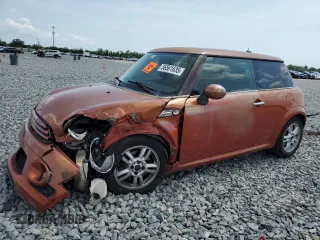 2011 MINI Hardtop with VIN WMWSU3C52BT094399, listed as a Copart auction lot 56561635 with 94,428 mi miles and Salvage Title. Bid and sale history available at DreamBid. Image 1.