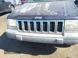 1997 Jeep Grand Cherokee Laredo z VIN 1J4GZ58Y2VC551199, wystawiony jako IAAI lot #42625502 z przebiegiem 210 722 mil mil oraz . Historia ofert i sprzedaży dostępna na DreamBid. Obrazek 6.