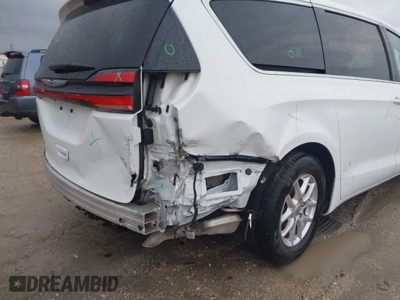 2023 Chrysler Pacifica Touring L with VIN 2C4RC1BG6PR520945, listed as a IAAI auction lot 41591128 with 70,351 mi miles and . Bid and sale history available at DreamBid. Image 6.