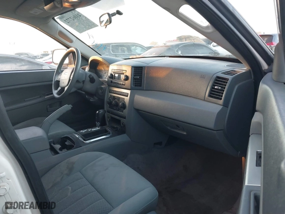 2006 Jeep Grand Cherokee Laredo with VIN 1J8GS48K16C348315, listed as a IAAI auction lot 41062772 with 239,662 mi miles. Bid and sale history available at carsss.com. Image 5.