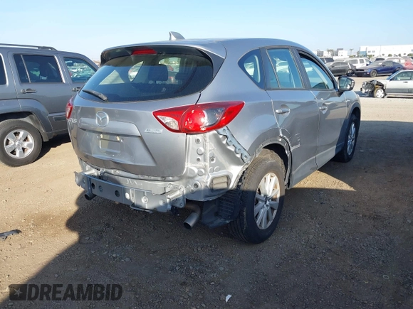 2014 Mazda CX-5 Sport with VIN JM3KE2BE9E0330345, listed as a IAAI auction lot 41377335 with 103,340 mi miles and . Bid and sale history available at carsss.com. Image 4.