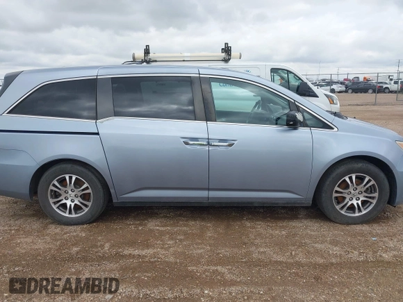 2011 Honda Odyssey EX-L with VIN 5FNRL5H64BB085479, listed as a IAAI auction lot 42404637 with 185,624 mi miles and . Bid and sale history available at DreamBid. Image 13.