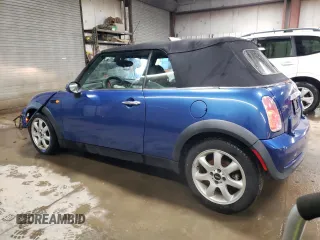 2007 MINI Convertible with VIN WMWRF33507TG16448, listed as a Copart auction lot 88474495 with 148,147 mi miles and Salvage Title. Bid and sale history available at DreamBid. Image 2.