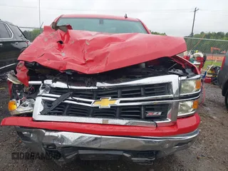 2014 Chevrolet Silverado 1500 LT with VIN 3GCUKREC9EG210621, listed as a IAAI auction lot 42011581 with Not Provided miles and . Bid and sale history available at DreamBid. Image 6.