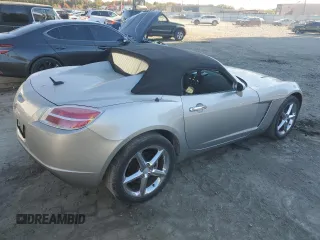 2007 Saturn Sky z VIN 1G8MB35B57Y124617, wystawiony jako Copart lot #76162604 z przebiegiem 140 003 mil mil oraz Szkody całkowita. Historia ofert i sprzedaży dostępna na DreamBid. Obrazek 3.
