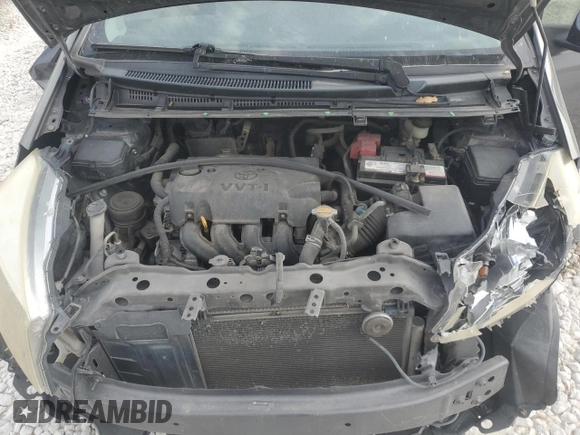 2013 Toyota Yaris L z VIN JTDJTUD33DD571231, wystawiony jako Copart lot #75826024 z przebiegiem 224 036 mil mil oraz Szkoda całkowita • Salvage title. Historia ofert i sprzedaży dostępna na DreamBid. Obrazek 11.