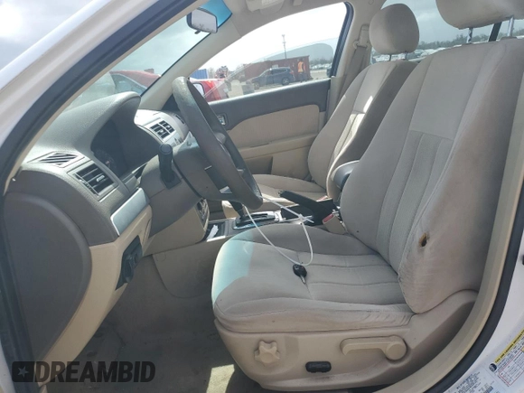 2006 Mercury Milan with VIN 3MEFM07186R641059, listed as a Copart auction lot 79450604 with 101,553 mi miles and Salvage title. Bid and sale history available at DreamBid. Image 7.