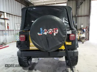 2002 Jeep Wrangler Sport z VIN 1J4FA49S02P730417, wystawiony jako Copart lot #59620865 z przebiegiem Nie podano mil oraz Szkoda całkowita • Salvage title. Historia ofert i sprzedaży dostępna na DreamBid. Obrazek 6.