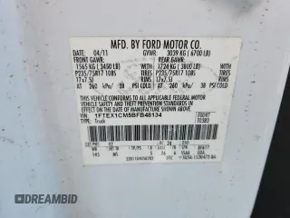 2011 Ford F-150 XL with VIN 1FTEX1CM5BFB48134, listed as a Copart auction lot 63298945 with 218,595 mi miles and Salvage title. Bid and sale history available at DreamBid. Image 12.