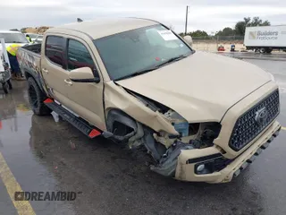 2019 Toyota Tacoma SR z VIN 3TMCZ5AN5KM191330, wystawiony jako IAAI lot #41450466 z przebiegiem 61 882 mil mil oraz . Historia ofert i sprzedaży dostępna na DreamBid. Obrazek 1.