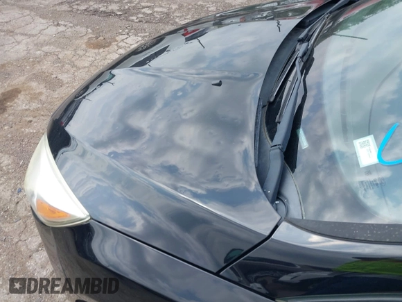 2016 Ford Focus SE z VIN 1FADP3F2XGL312445, wystawiony jako IAAI lot #42288210 z przebiegiem 64 115 mil mil oraz . Historia ofert i sprzedaży dostępna na DreamBid. Obrazek 6.