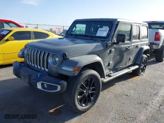 2023 Jeep Wrangler 4xe Sahara with VIN 1C4JJXP68PW661190, listed as a IAAI auction lot 41816483 with 41,877 mi miles. Bid and sale history available at carsss.com. Image 2.