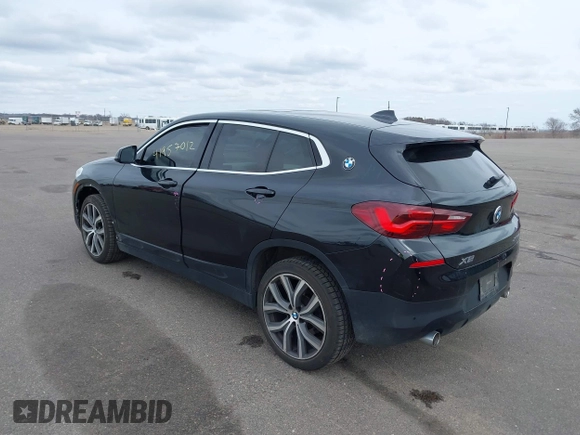 2020 BMW X2 xDrive28i with VIN WBXYJ1C02L5R71755, listed as a IAAI auction lot 41957012 with 69,997 mi miles. Bid and sale history available at carsss.com. Image 3.