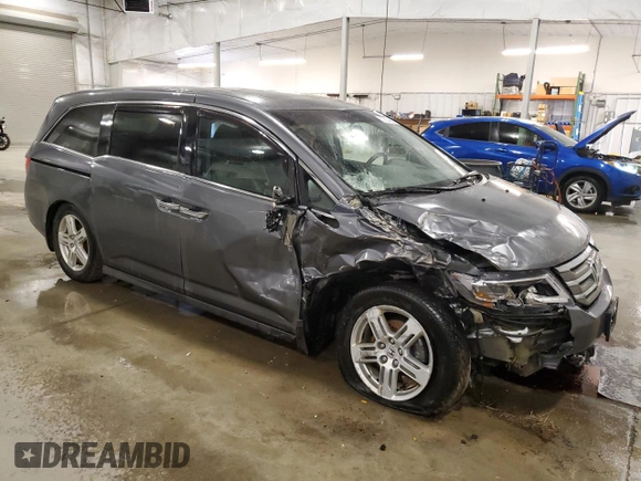 2012 Honda Odyssey Touring with VIN 5FNRL5H98CB028309, listed as a Copart auction lot 57663485 with 233,921 mi miles and Salvage title. Bid and sale history available at DreamBid. Image 4.