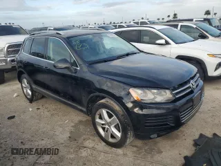 2012 Volkswagen Touareg Exec with VIN WVGEF9BP1CD011407, listed as a Copart auction lot 79199754 with 57,376 mi miles and Salvage Title. Bid and sale history available at DreamBid. Image 4.