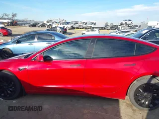 2022 Tesla Model 3 with VIN 5YJ3E1EA1NF288903, listed as a IAAI auction lot 41610215 with 96,050 mi miles and . Bid and sale history available at DreamBid. Image 14.