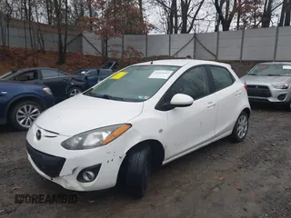2012 Mazda 2 Touring z VIN JM1DE1LY4C0141202, wystawiony jako IAAI lot #41051663 z przebiegiem 160 364 mil mil oraz . Historia ofert i sprzedaży dostępna na DreamBid. Obrazek 2.