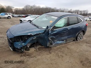 2020 Ford Escape Titanium z VIN 1FMCU9J91LUA73891, wystawiony jako Copart lot #89178475 z przebiegiem 35 579 mil mil oraz Szkody całkowita. Historia ofert i sprzedaży dostępna na DreamBid. Obrazek 1.