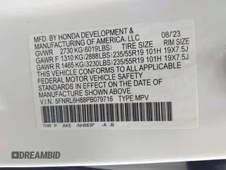 2023 Honda Odyssey Touring with VIN 5FNRL6H88PB079716, listed as a IAAI auction lot 42208628 with 26,679 mi miles and . Bid and sale history available at DreamBid. Image 9.